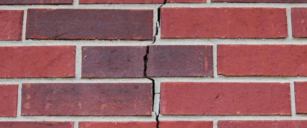 cracks in a brick wall